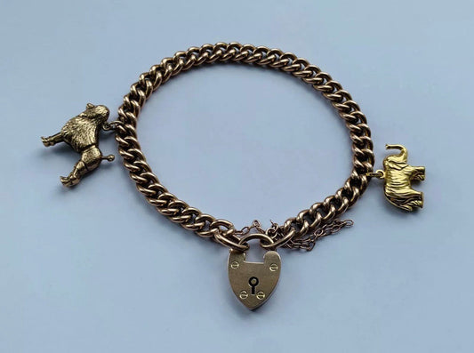 Victorian 9ct Rose Gold Charm Padlock Bracelet With 9ct Gold Charms on a Curb Chain